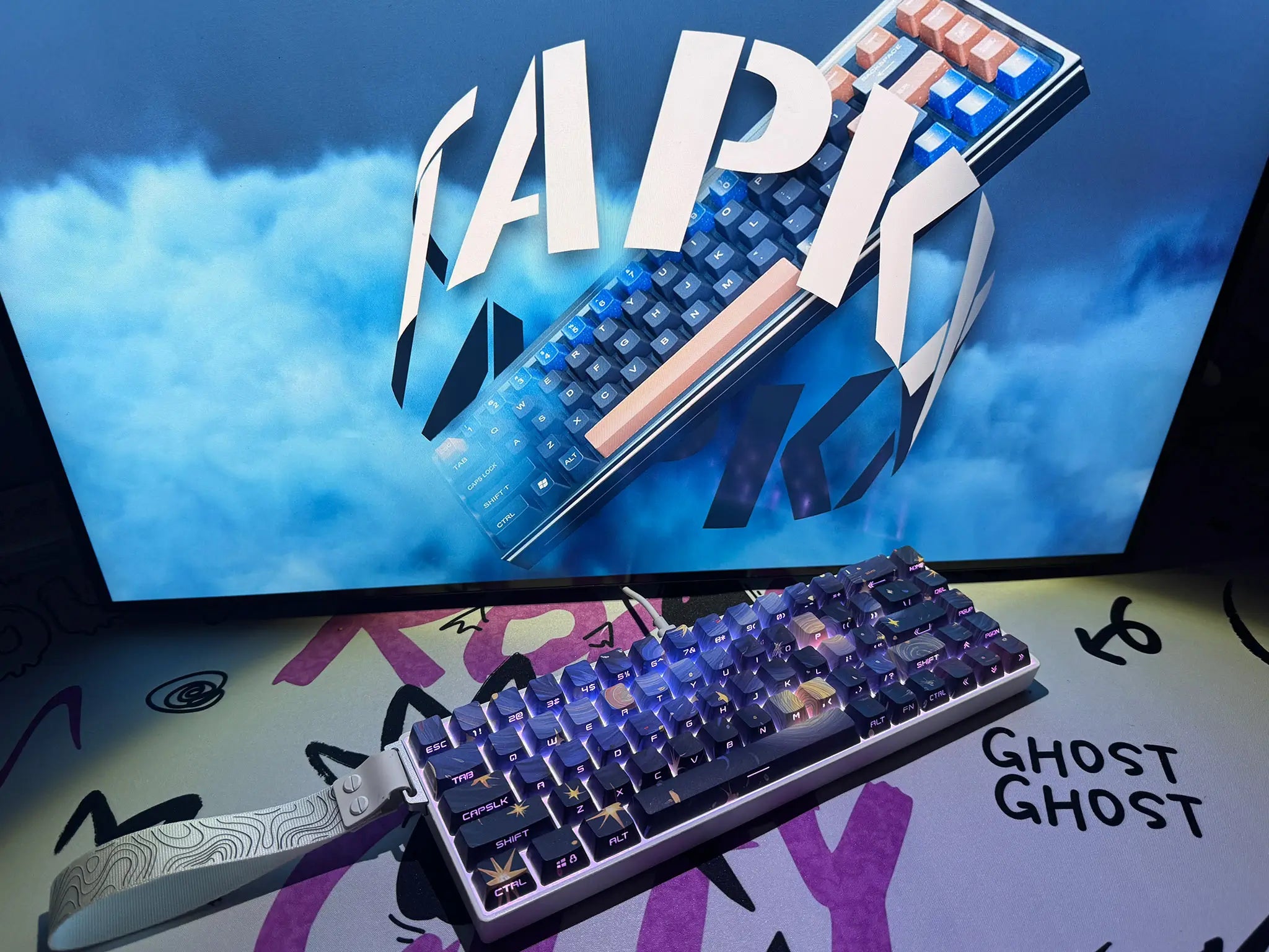 Tapkx Milky Way KX68 mechanical keyboard featured in a cosmic-themed office setup